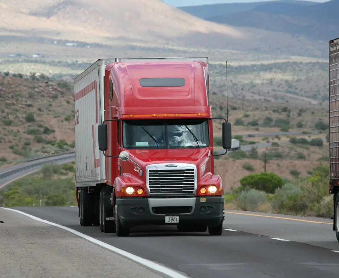 Semi tractor-trailer on the highway — trucking accident practice, Ave Maria Law Center